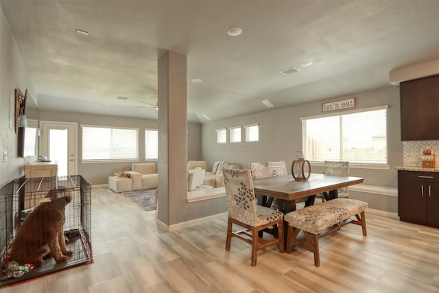 dining space featuring light hardwood / wood-style flooring and ceiling fan