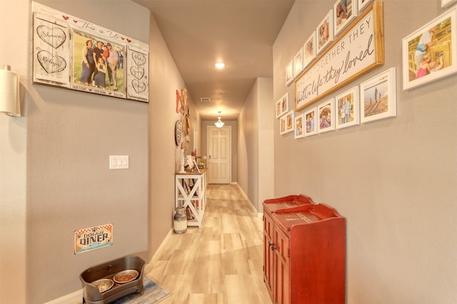 corridor featuring hardwood / wood-style floors