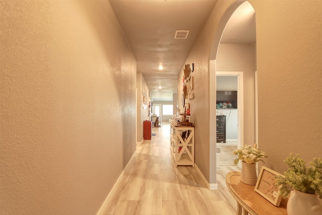 corridor featuring hardwood / wood-style flooring