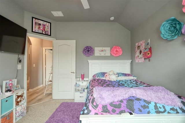 bedroom with vaulted ceiling, ceiling fan, and light carpet