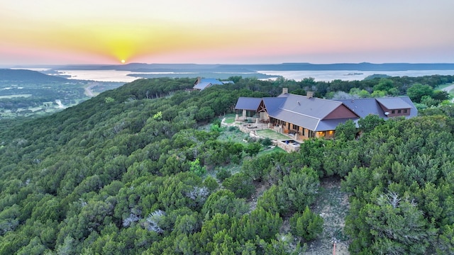 aerial view at dusk with a water view