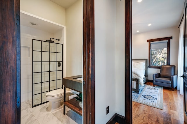 bathroom with tile floors and toilet