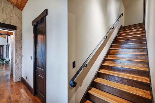 staircase with hardwood / wood-style flooring