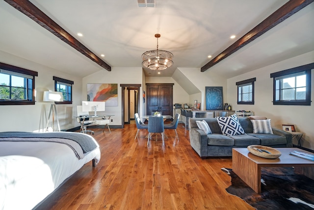 bedroom featuring vaulted ceiling with beams, wood-type flooring, and a chandelier