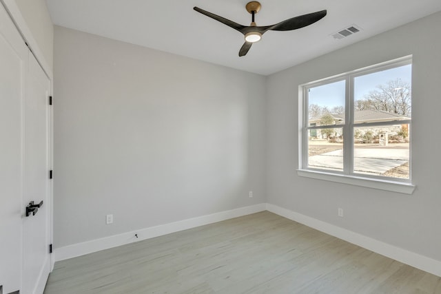 unfurnished room featuring light wood-type flooring and ceiling fan