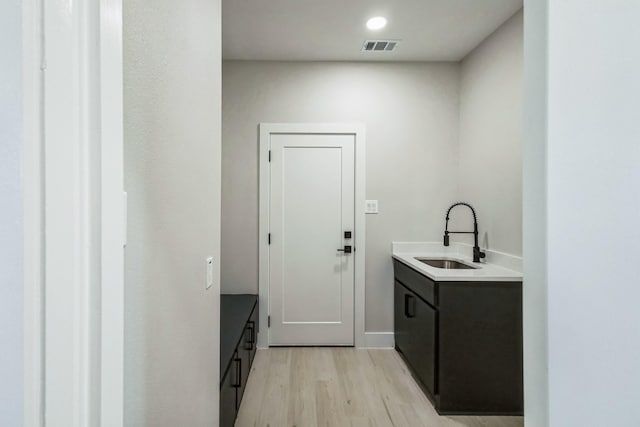 interior space with sink and light hardwood / wood-style floors