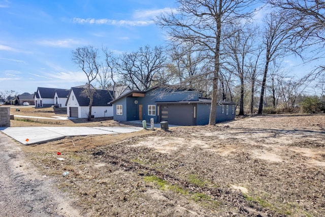 back of property featuring a garage