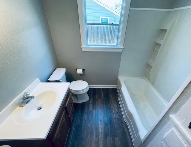 bathroom featuring hardwood / wood-style floors, vanity, and toilet