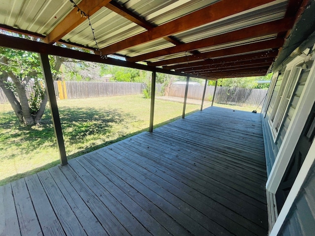 wooden terrace featuring a yard