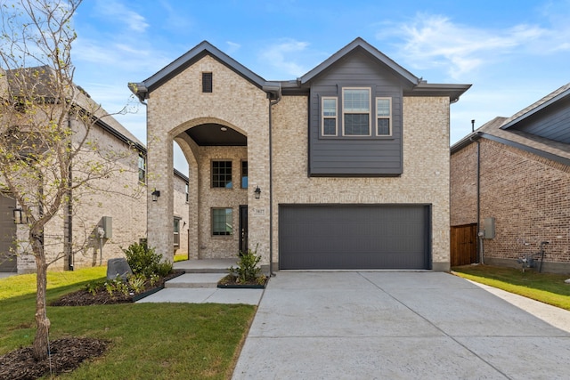 view of front facade with a garage, a front yard, concrete driveway, and brick siding