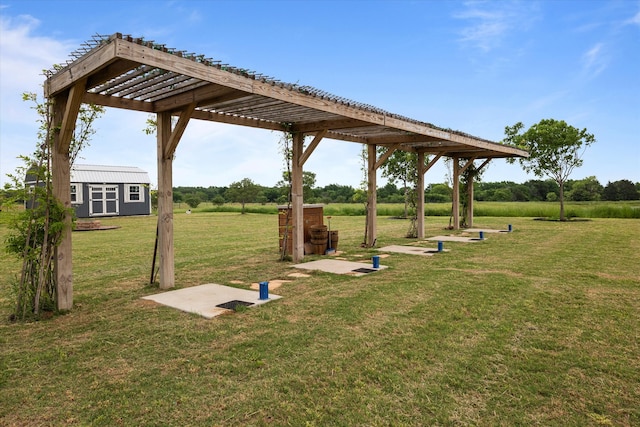 view of home's community featuring a storage shed, a lawn, a pergola, and an outdoor structure