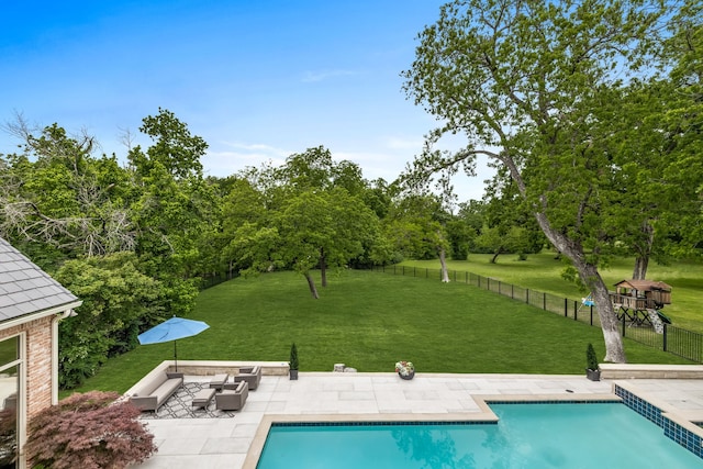 view of swimming pool featuring a yard and a patio