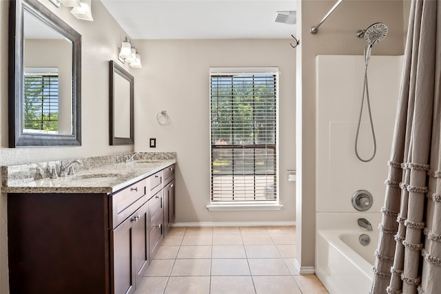 bathroom featuring tile patterned flooring, plenty of natural light, vanity, and shower / bathtub combination with curtain