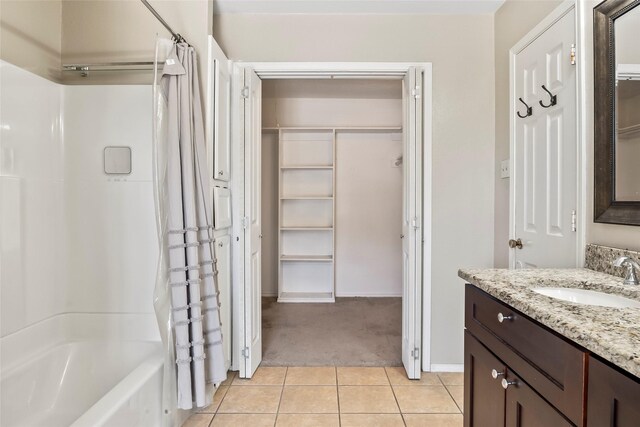 bathroom with tile patterned flooring, vanity, and shower / bath combo