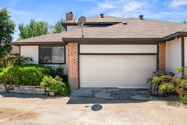 ranch-style home featuring a garage