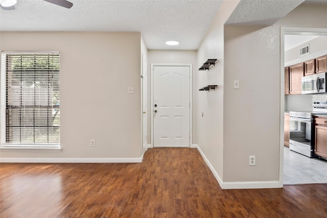 entryway featuring a healthy amount of sunlight and hardwood / wood-style flooring