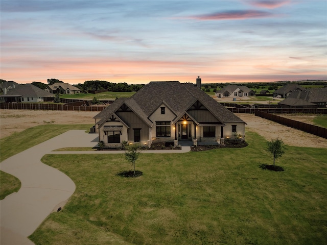 view of front of property with a lawn