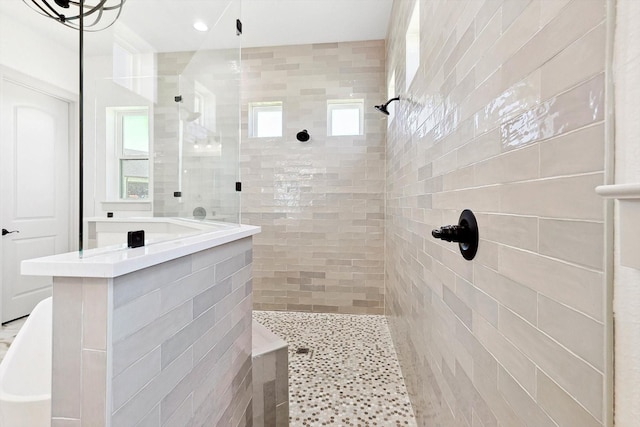 bathroom with a tile shower