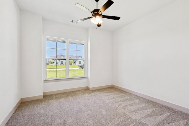 unfurnished room featuring carpet floors and ceiling fan