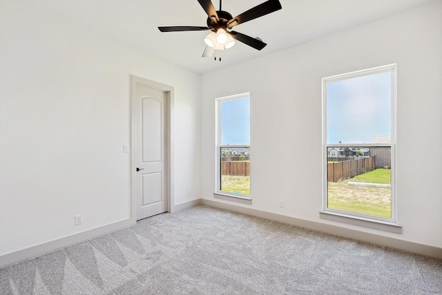 carpeted empty room with ceiling fan