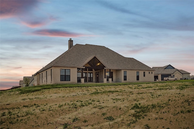 view of front of property with a yard