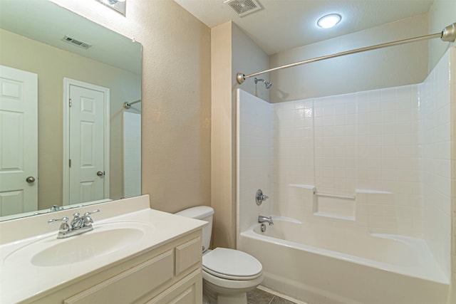 full bathroom featuring tile flooring, a textured ceiling, washtub / shower combination, toilet, and vanity