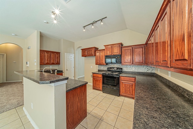 kitchen with light carpet, black appliances, backsplash, vaulted ceiling, and track lighting