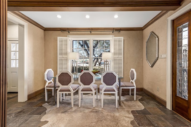 dining room featuring crown molding