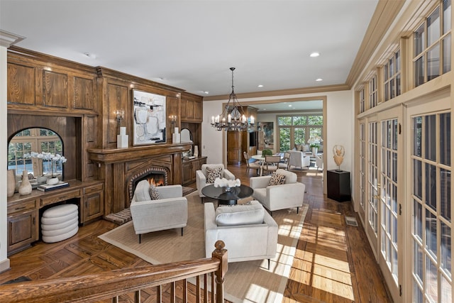 living room featuring dark wood-type flooring, crown molding, french doors, and a notable chandelier