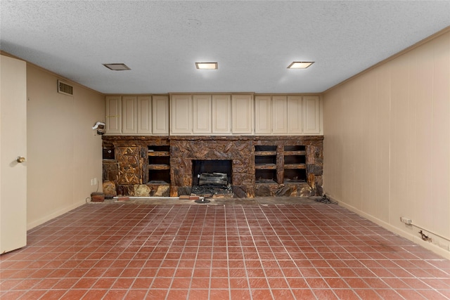 basement featuring a fireplace and a textured ceiling