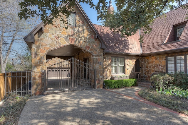 view of front of home featuring a balcony