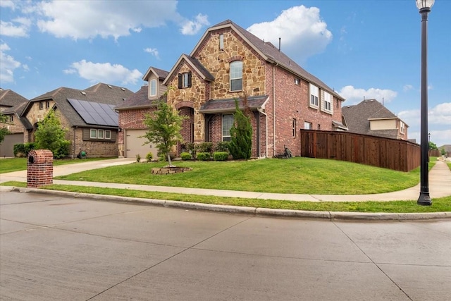 view of front facade featuring a front lawn and a garage