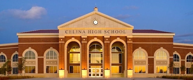 view of outdoor building at dusk