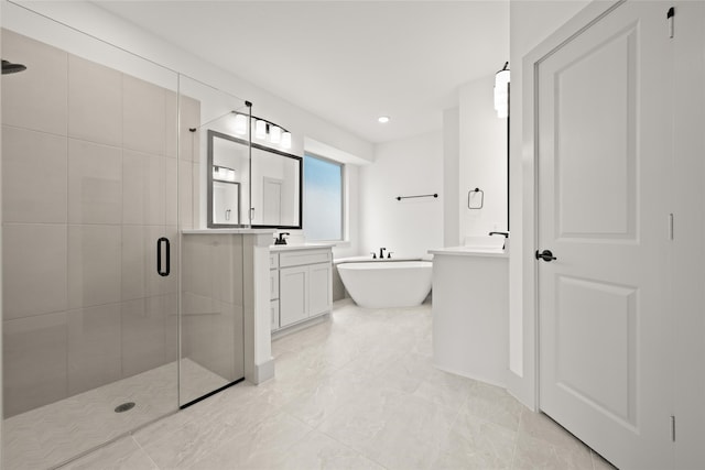 bathroom featuring vanity and separate shower and tub