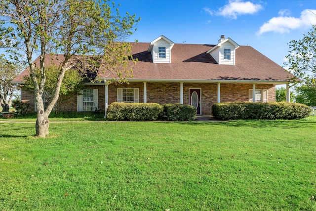 new england style home with a front lawn