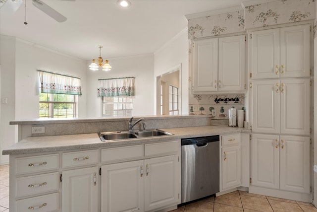 kitchen with sink, dishwasher, light tile flooring, white cabinetry, and ceiling fan with notable chandelier