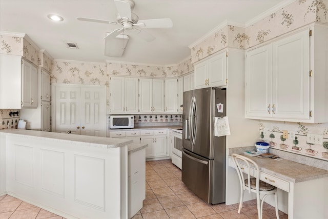 kitchen featuring backsplash, white appliances, ceiling fan, light tile flooring, and white cabinets