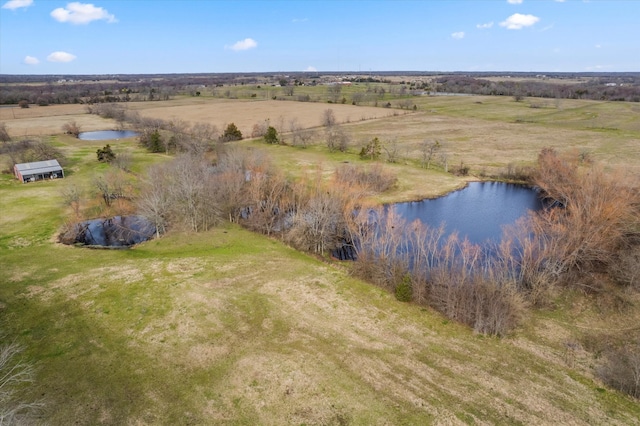 drone / aerial view with a rural view and a water view