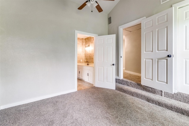 unfurnished room with beamed ceiling and carpet floors