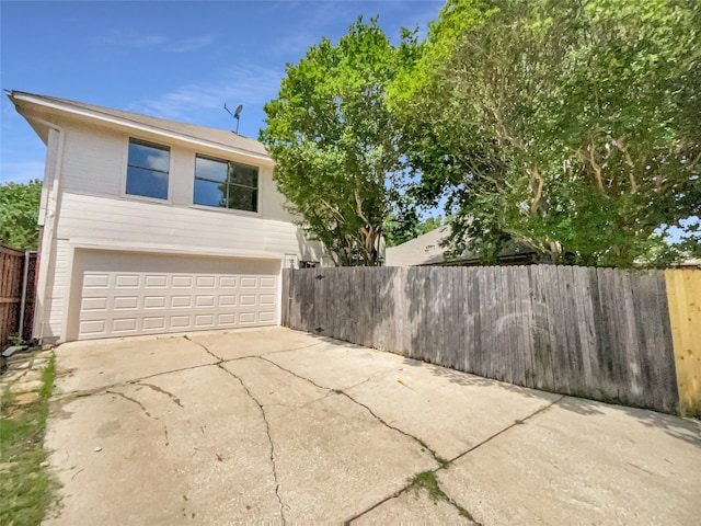 view of side of property featuring a garage