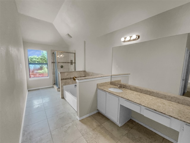 bathroom with vanity, separate shower and tub, vaulted ceiling, and tile patterned floors