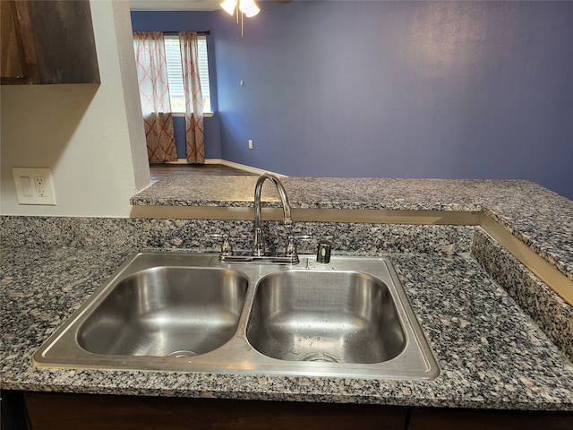 room details featuring ceiling fan and sink