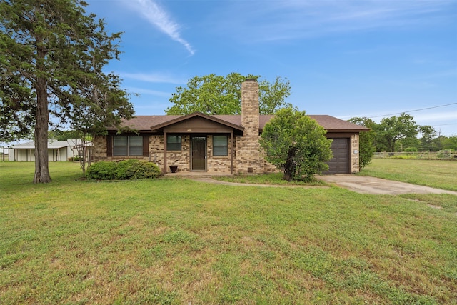 view of front of home featuring a garage and a front lawn