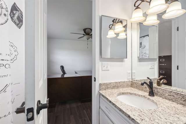 bathroom featuring wood-type flooring, ceiling fan, and vanity