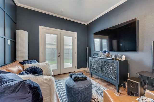 living room featuring ornamental molding, french doors, and light wood-type flooring