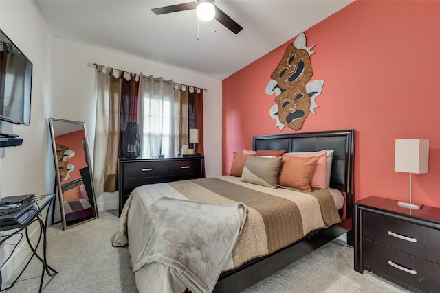 bedroom with ceiling fan and light colored carpet