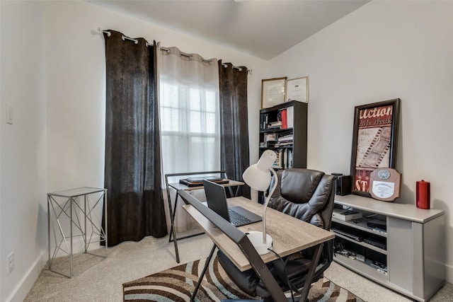 office area with light carpet and lofted ceiling