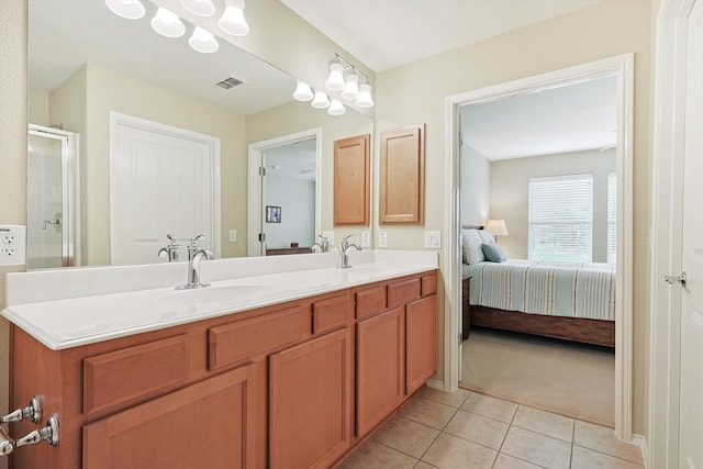 bathroom with dual sinks, a chandelier, tile flooring, and large vanity