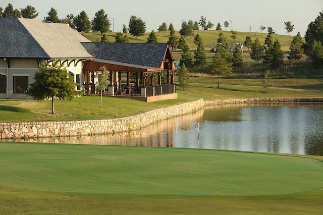 view of nearby features featuring a water view and a lawn