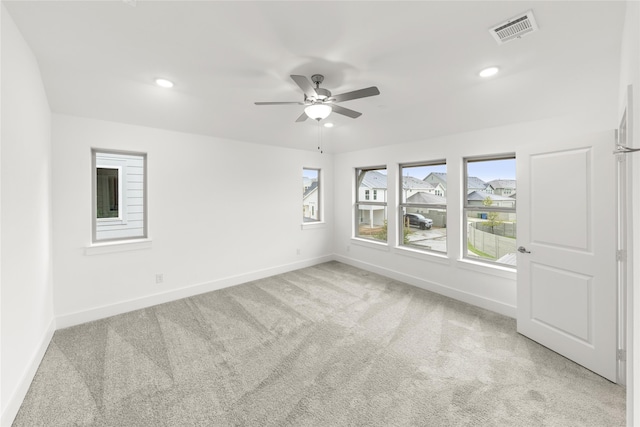 carpeted empty room with ceiling fan